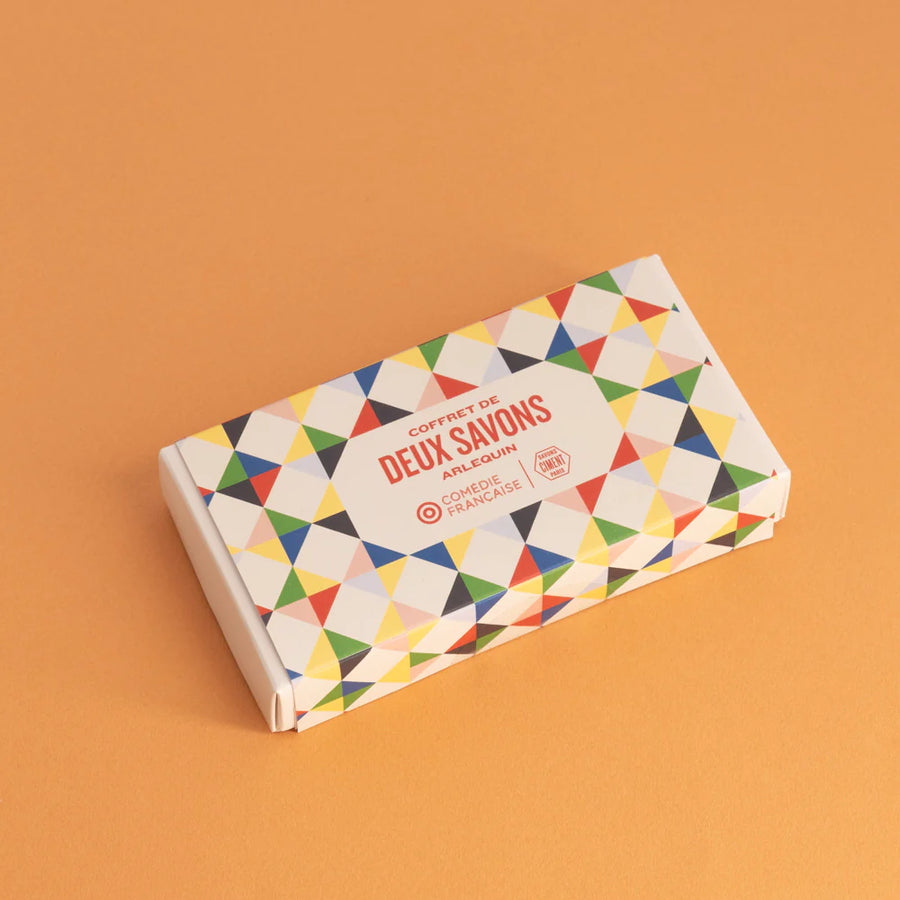 Organic Ciment Arlequin soap gift box set with vibrant geometric patterns in bright colors, placed on an orange backdrop.