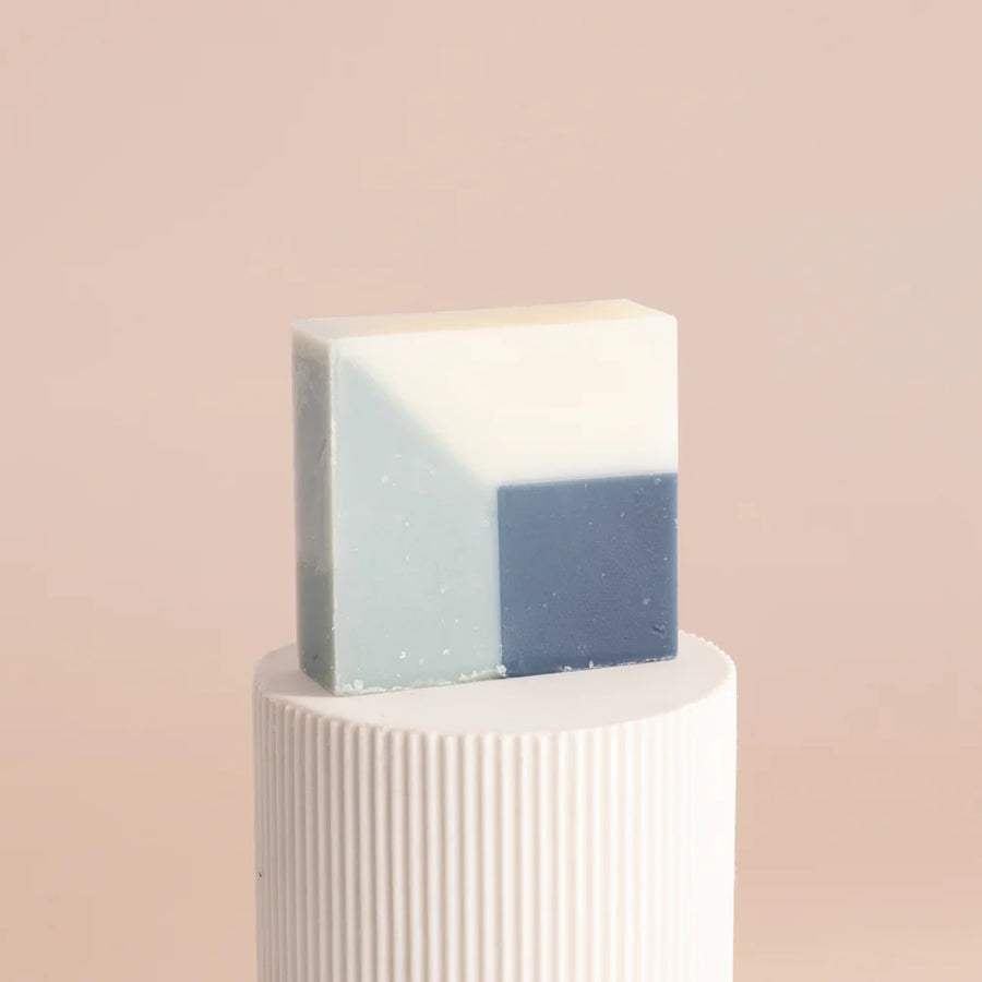 Unwrapped blue organic Ciment soap called Soap Window Fleurs de Pommier with an apple blossom scent.