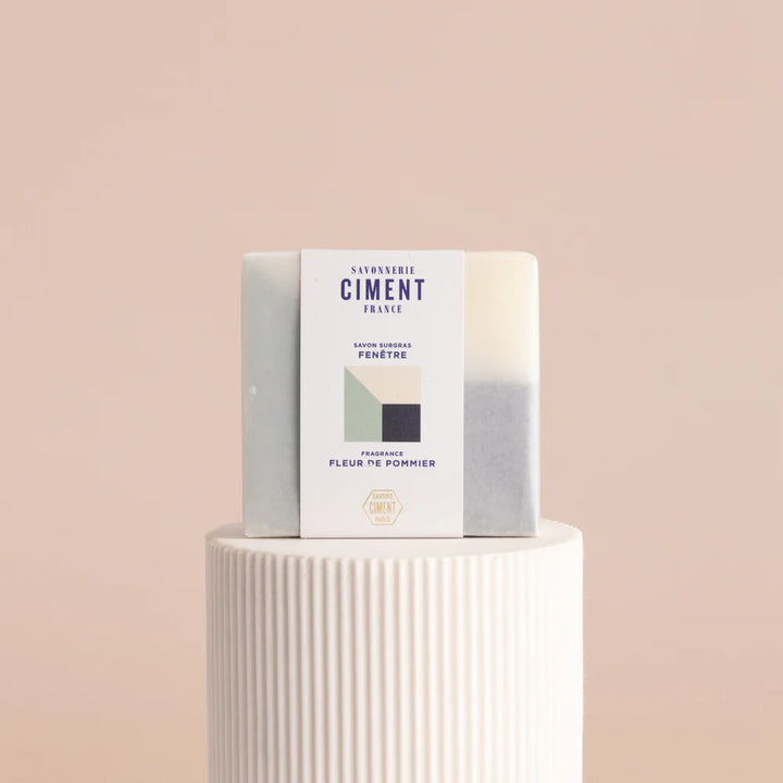 Blue organic Ciment soap called Soap Window Fleurs de Pommier, still wrapped, with an apple blossom scent.