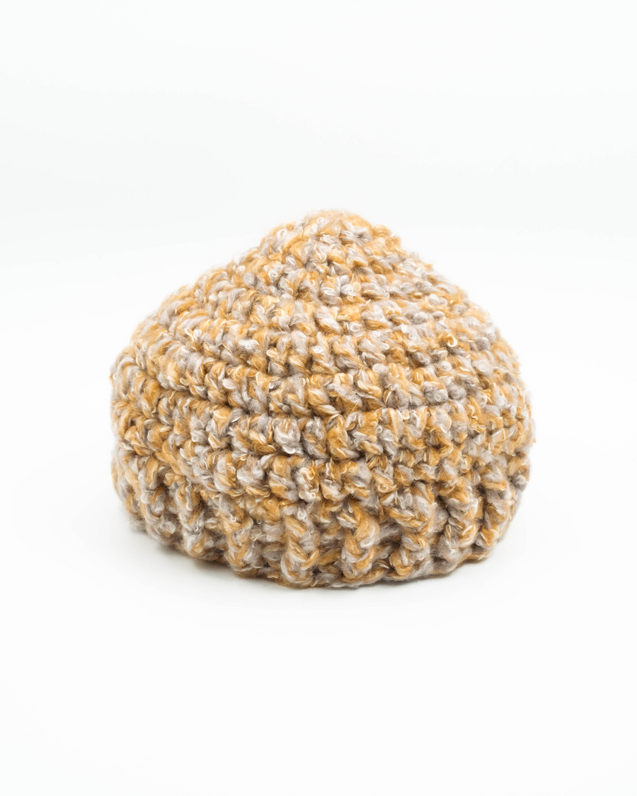 Textured knitted beanie on a white background