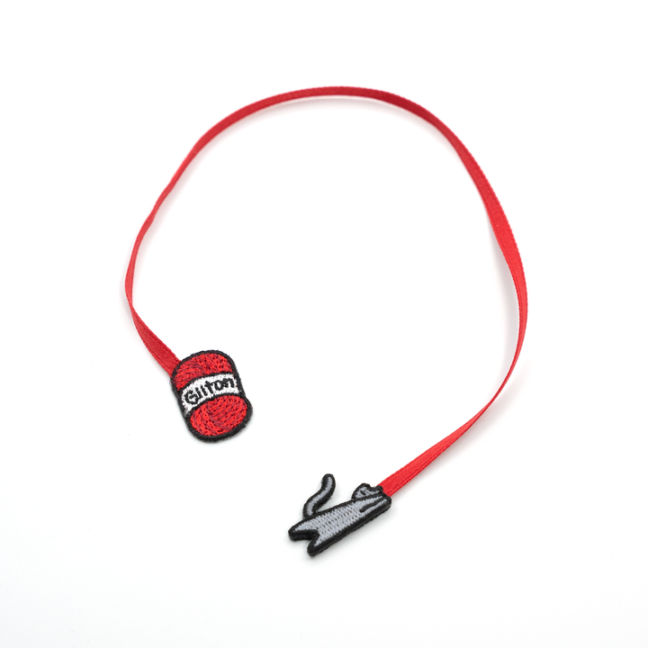 Bookmark with a red yarn and grey cat on a white background