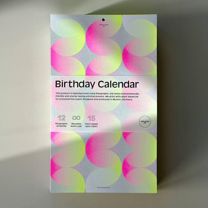 Risograph birthday perpectual calendar with colorful circle design on a gray background