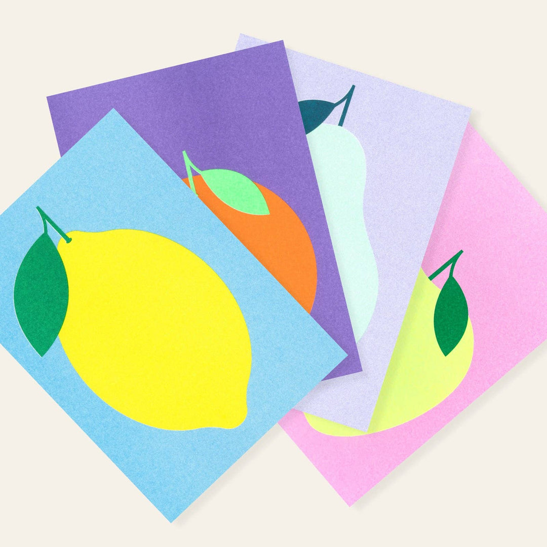 Four colorful cards with fruit illustrations on a white background