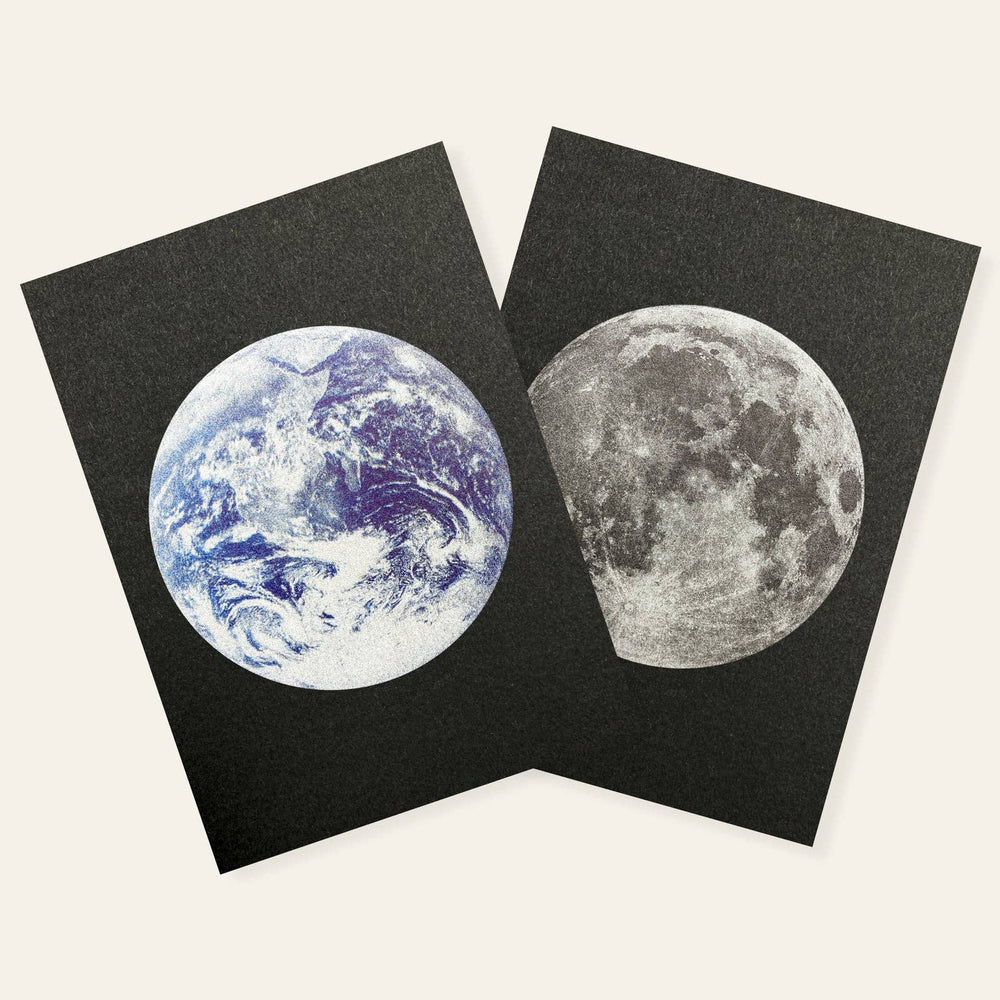 Two black postcards with images of Earth and the moon