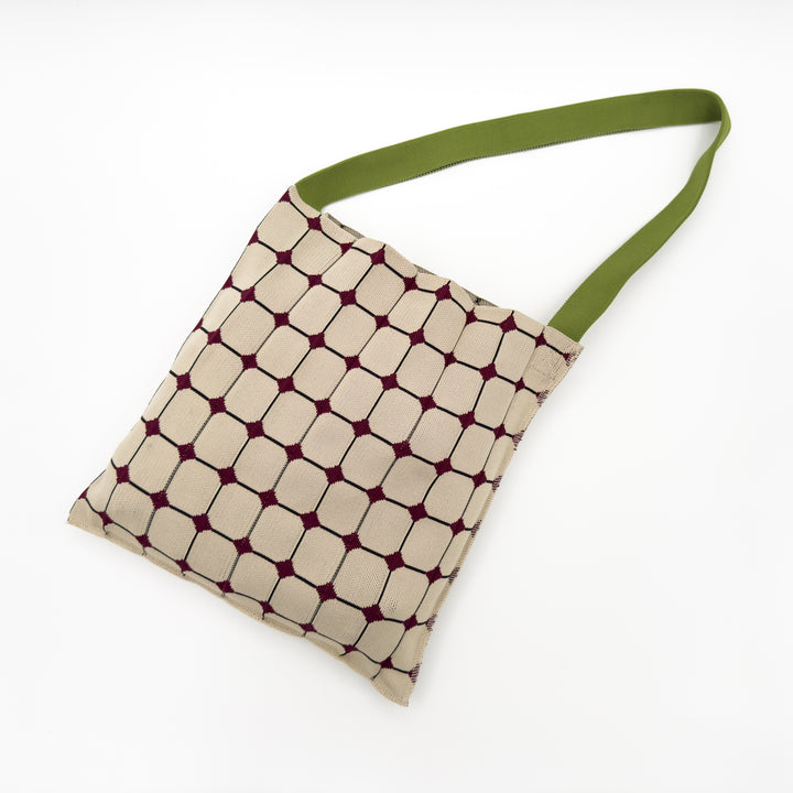 Image of the KNT 365 Knitty Tote Bag in beige, featuring a diamond pattern and green straps, handmade in Japan, showcasing its unique and stylish design.