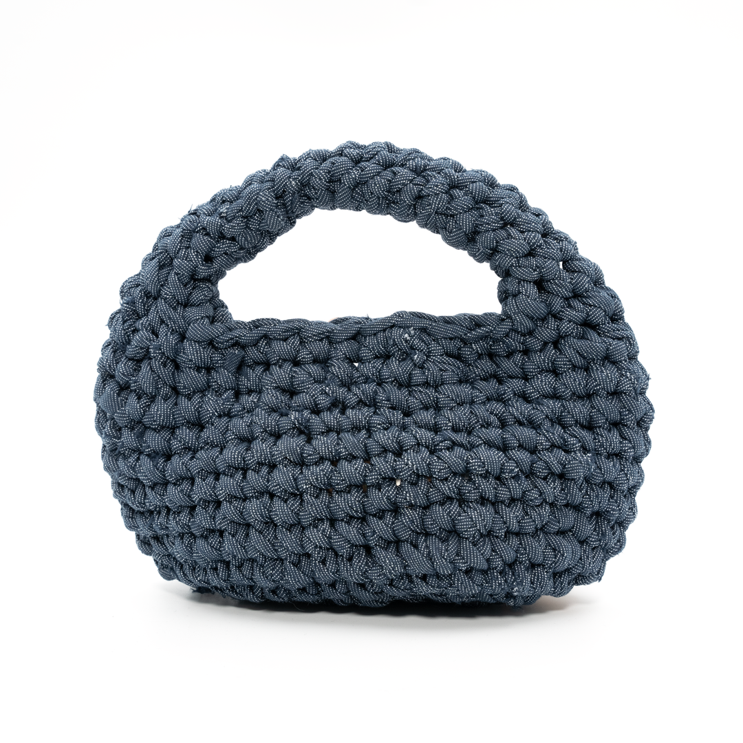 Blue woven handbag on a white background
