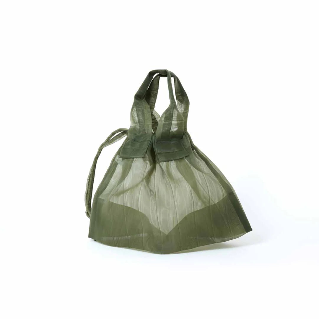 Image showcasing a Japan Mate Mono see-through bag in khaki, stylishly displayed against a clean white background.