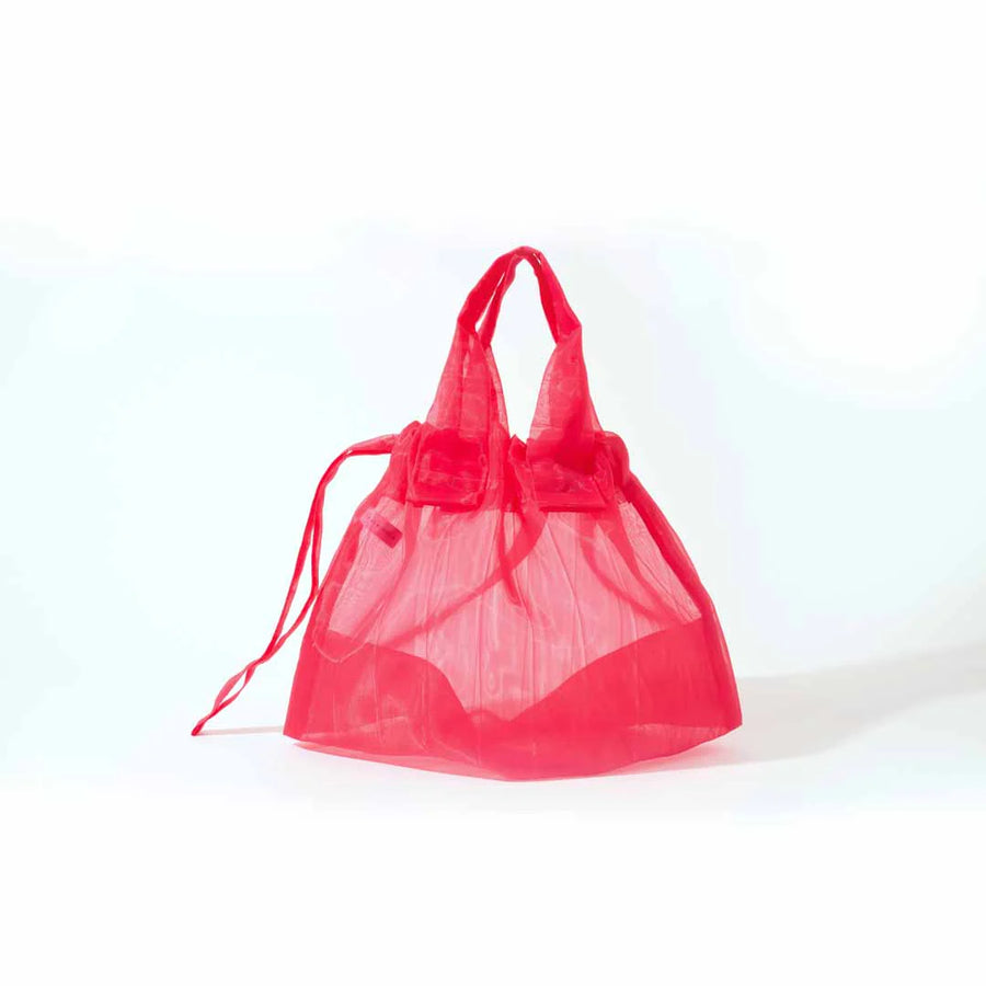 Image showcasing a Japan Mate Mono see-through bag in pink, stylishly displayed against a clean white background.