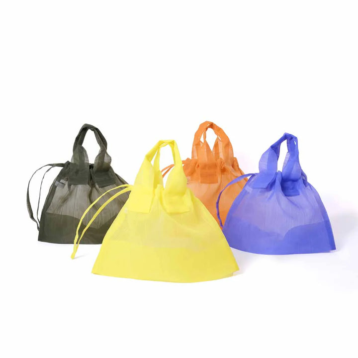 Banner featuring four Japan Mate Mono see-through bags in various colours, stylishly placed against a clean white background.