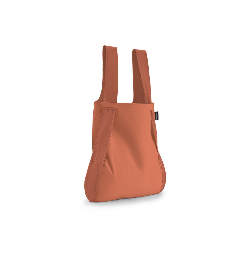 Image of a Terracotta Notabag displayed in its backpack shape, showcasing its versatility and design.