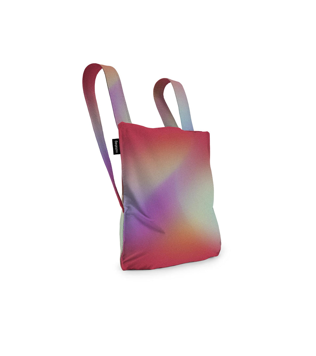 Image of a Notabag displayed in its backpack shape, designed to resemble a sunbeam with vibrant colors of red, purple, orange, and green, showcasing its versatility and unique design.