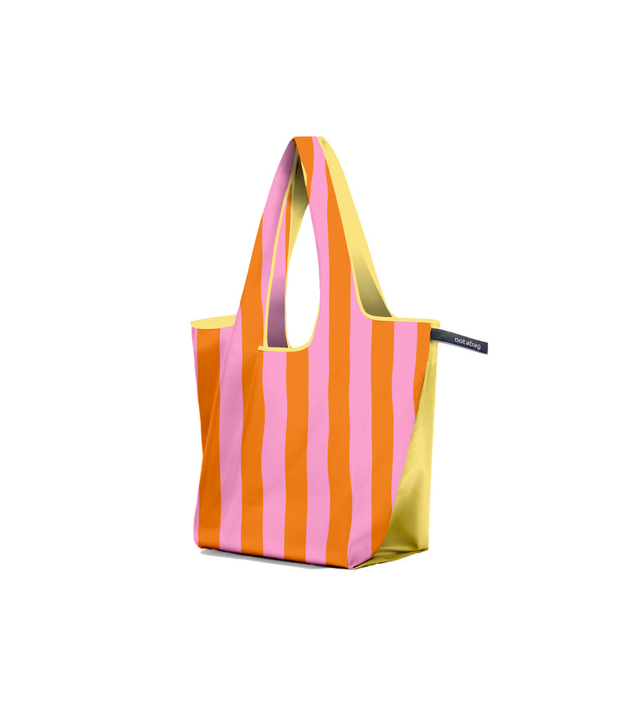 Multicolored striped tote bag on a white background