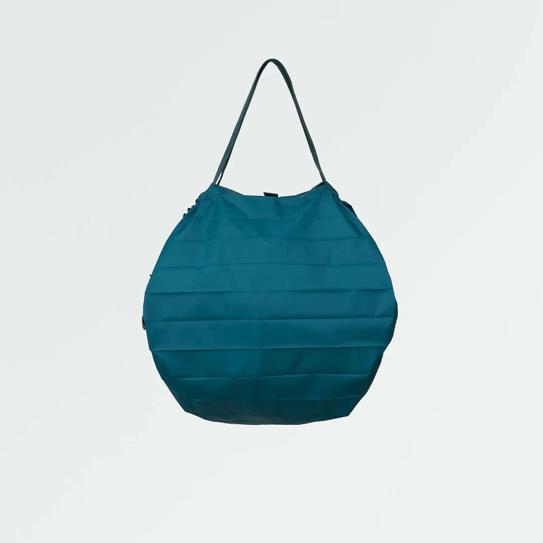Blue bag with a strap on a light gray background