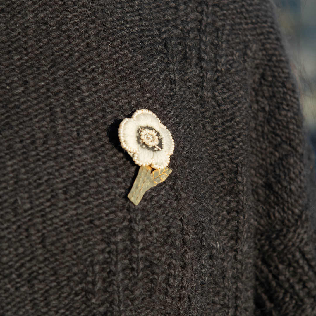 White Floral brooch on a jumper