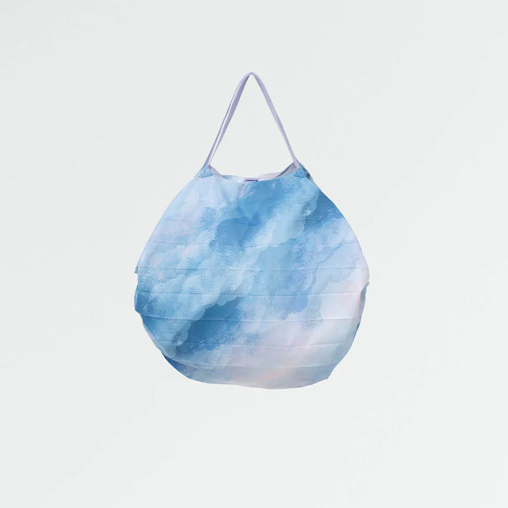 Blue watercolor patterned bag on a light gray background
